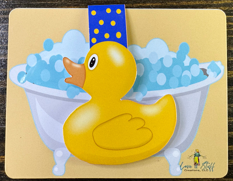 Yellow rubber duck magnetic bookmark with blue polka dot tab, shaped like a classic duck toy