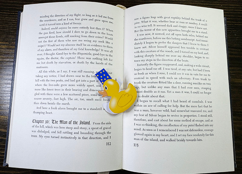 Yellow rubber duck magnetic bookmark with blue polka dot tab, shaped like a classic duck toy