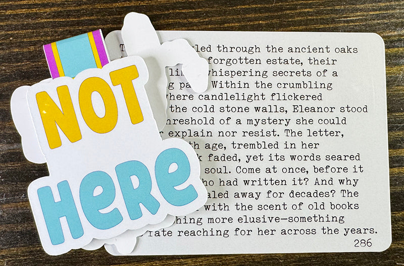 Funny magnetic bookmark with bold “Not Here” text in yellow and blue