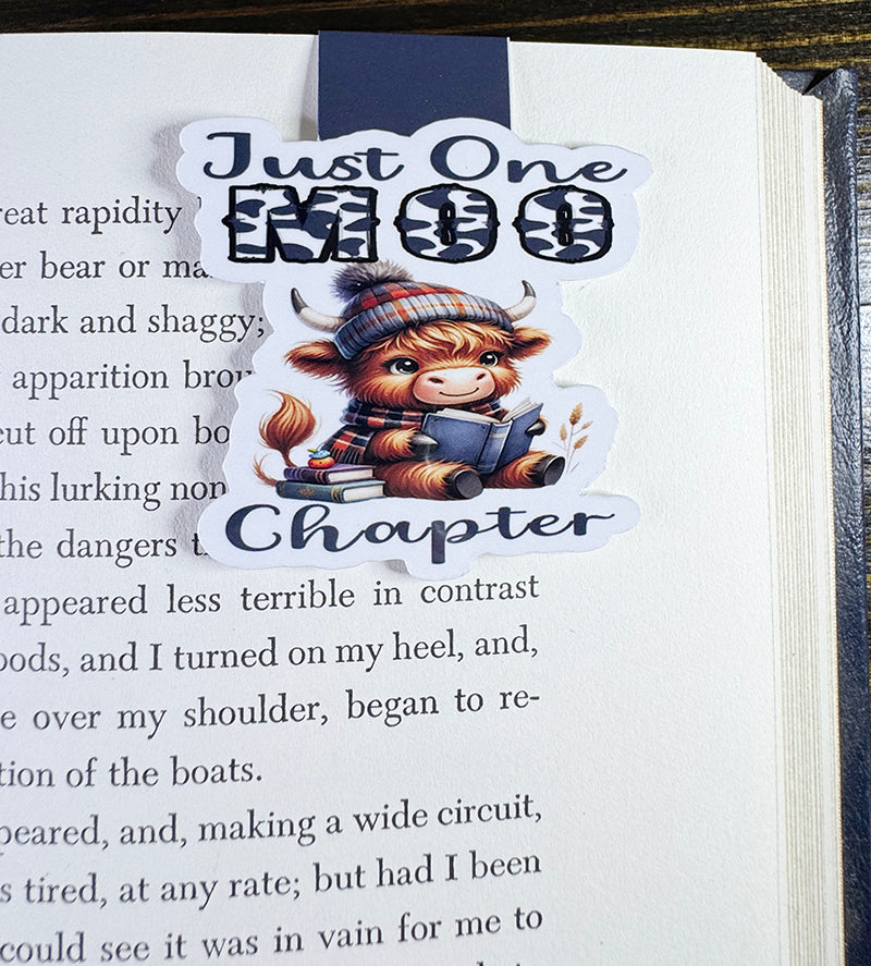 “Cute Highland cow magnetic bookmark with book and plaid beanie that says 'Just One Moo Chapter'”