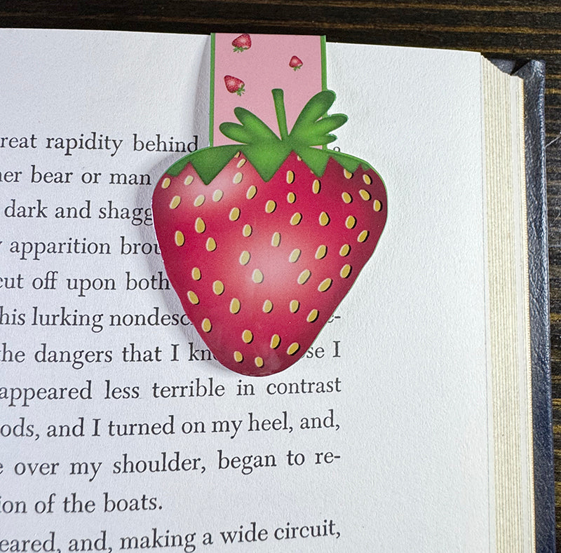 Cute strawberry magnetic bookmark with pink background and yellow seed details