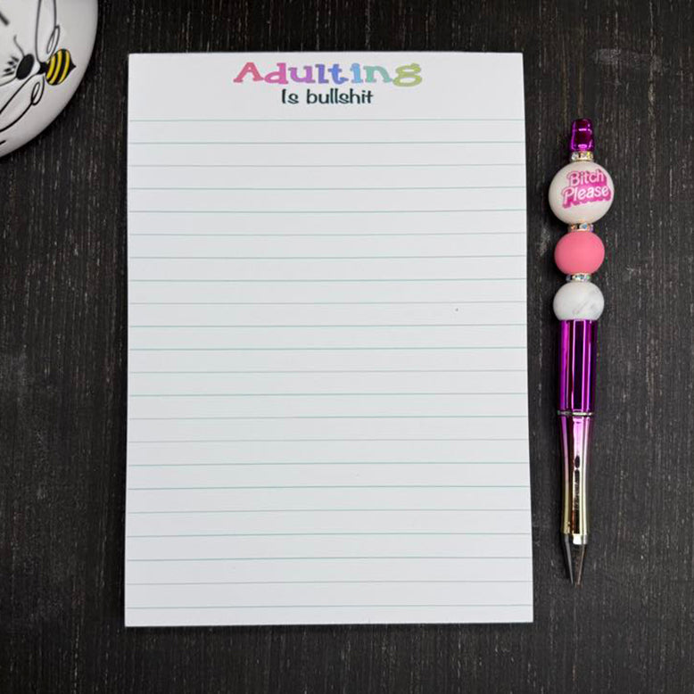 5x7 funny notepad with the phrase “Adulting Is Bullshit” at the top, lined pages, 50 sheets – part of the Notions notepad collection.