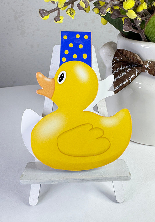 Yellow rubber duck magnetic bookmark with blue polka dot tab, shaped like a classic duck toy