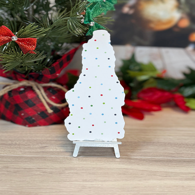 “Back view of classic bookmark with festive polka-dot pattern displayed upright in front of holiday greenery and Christmas décor.”