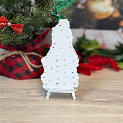 “Back view of classic bookmark with festive polka-dot pattern displayed upright in front of holiday greenery and Christmas décor.”