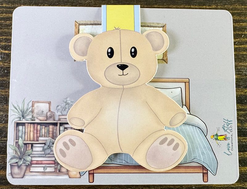 Teddy bear magnetic bookmark with soft beige bear design and yellow-blue striped magnetic tab