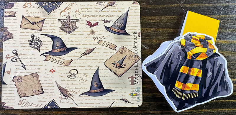 Wizard robe magnetic bookmark with black cloak and yellow-striped scarf on yellow tab background
