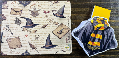 Wizard robe magnetic bookmark with black cloak and yellow-striped scarf on yellow tab background