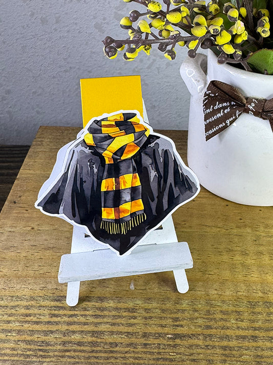 Wizard robe magnetic bookmark with black cloak and yellow-striped scarf on yellow tab background