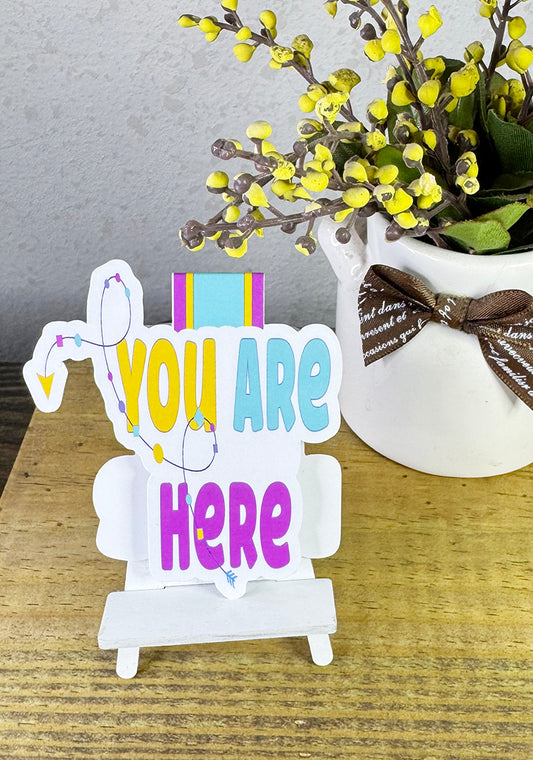 Colorful magnetic bookmark with “You Are Here” text and arrow path design