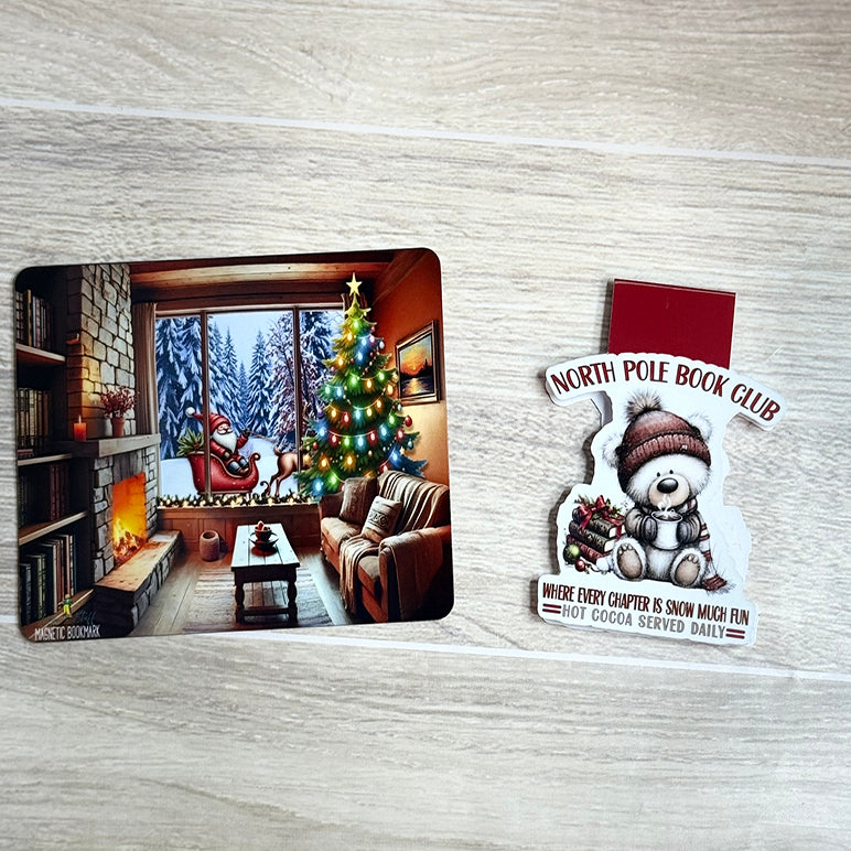 “North Pole Book Club magnetic bookmark with Christmas bear and cozy fireplace backing card flat lay.”