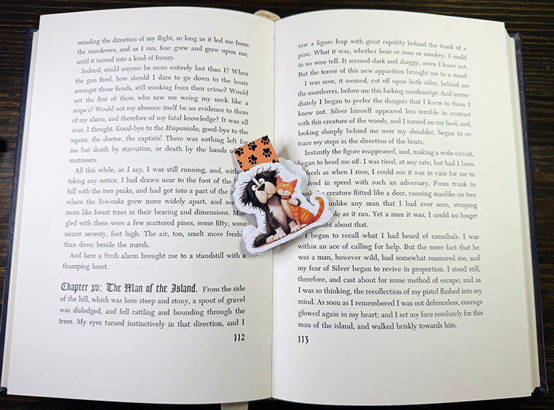 Magnetic bookmark with cute black dog and orange tabby cat hugging, on paw print background